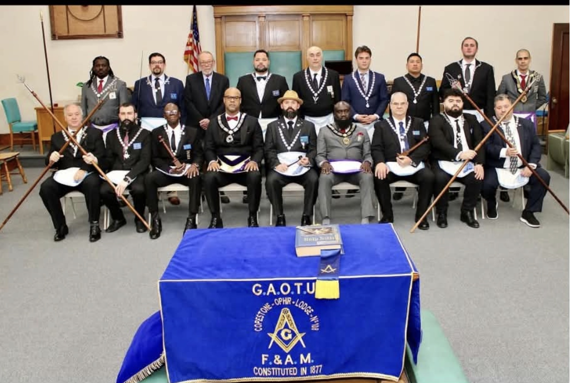 A group gathered behind a Copestone-Ophir Lodge No. 108 cloth; date and occasion unknown